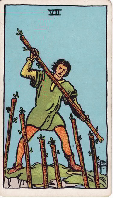 Seven of Wands tarot card – defense, challenge, standing firm.