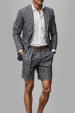 a man in a plaid suit and tie 