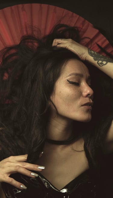 a woman with a red umbrella in a black dress