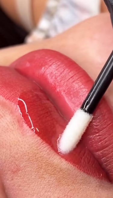 Permanent lip blush treatment being applied at Glam S Beauty.