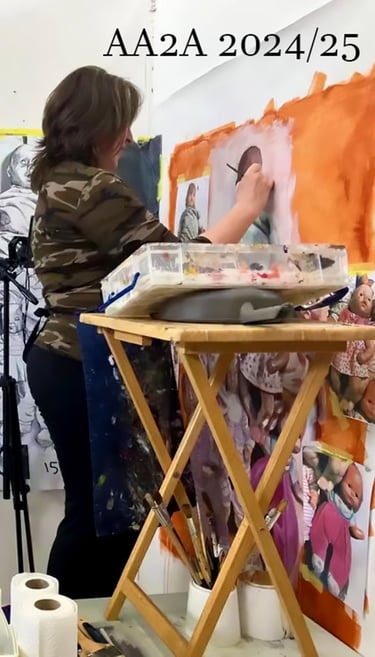 A studio photo of the artist Christine Gallagher at her work at the University of Chester