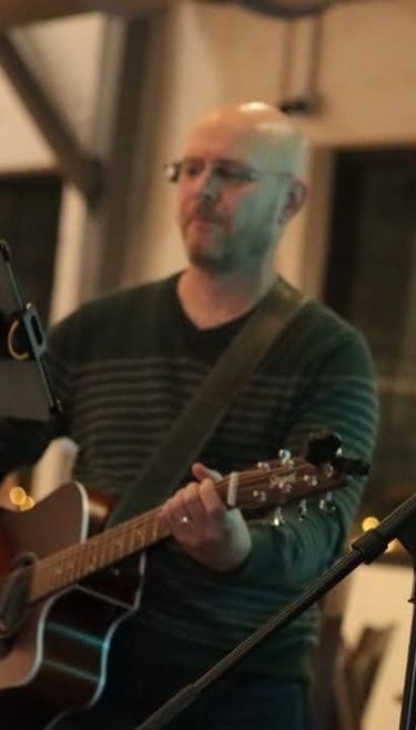 William Finn from Finn's Echo performing in front of live audience