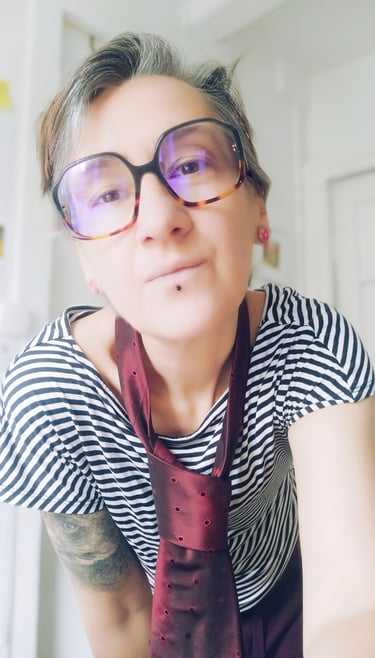 a woman with glasses and a tie dye dye dye dye dye dye dye dye dye