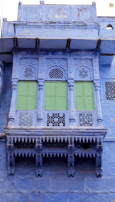 Traditional blue-painted jharokha in the old city of Jodhpur, showcasing Rajasthani architecture and heritage.
