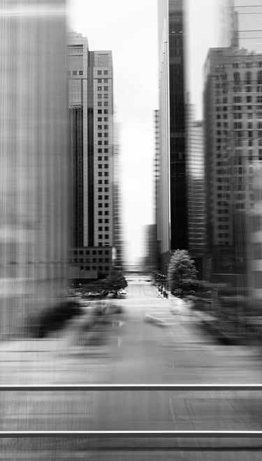 a city street scene with a train passing by