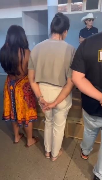 a group of people standing around a counter