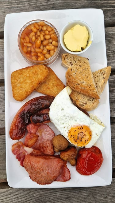 a plate of food with beans, toasted beans, toasted beans, and