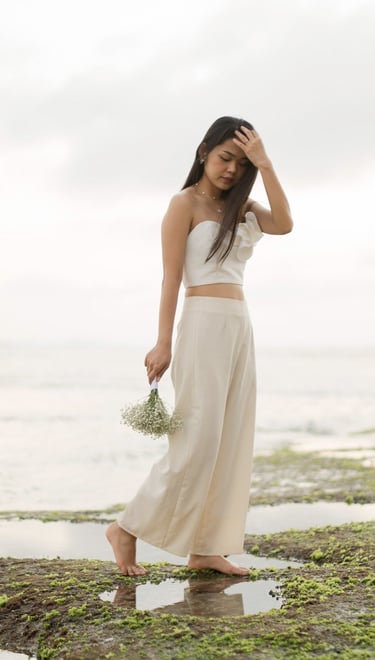 Bachelorette party group portrait with cliffs at Melasti Beach Bali