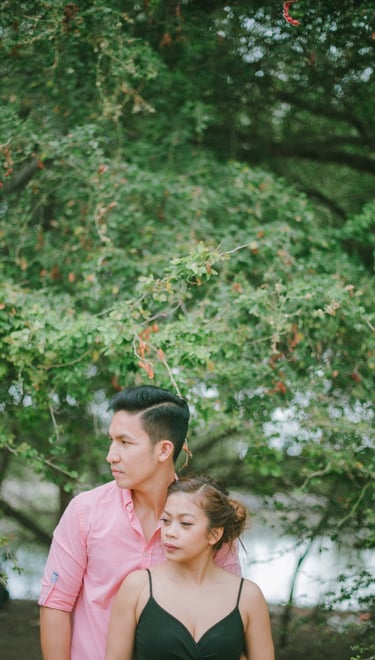 Romantic couple portrait under green trees at Serangan Benoa Bali.