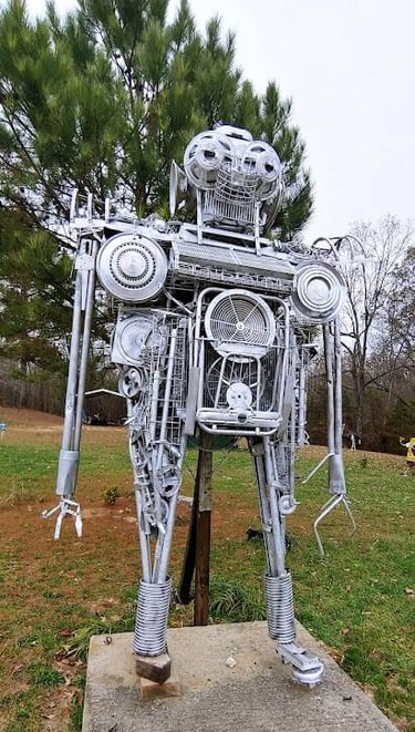 Mentone, AL - A robot made of metal parts on the road up the mountain