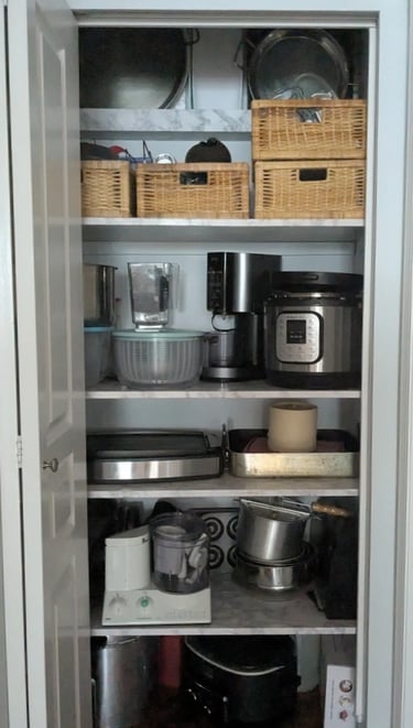 New kitchenware shelving, filld neatly with heavy appliances