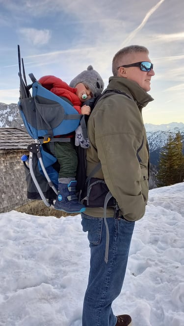 Father and son on snowy mountain
