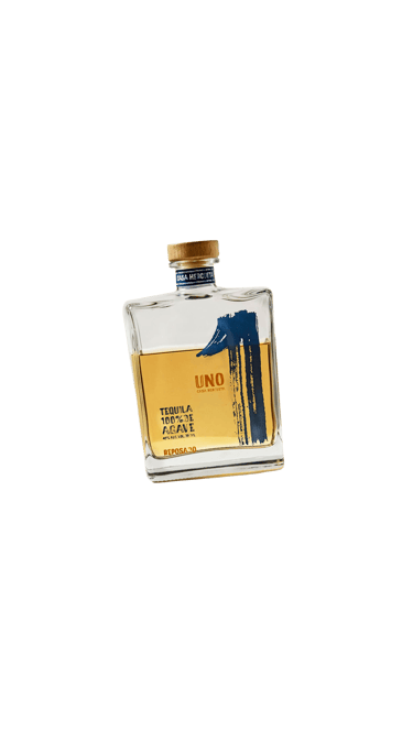 a bottle of tequila - uno tequila reposado