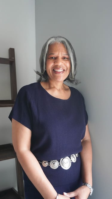 a woman with grey hair and a belt belt