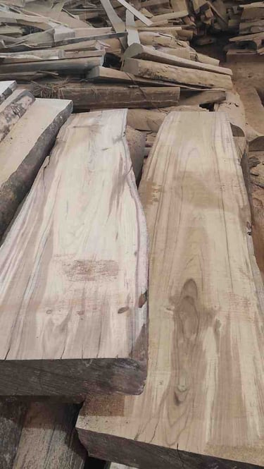 “Bulk collection of unfinished teak wood logs stacked for export in wholesale packaging”