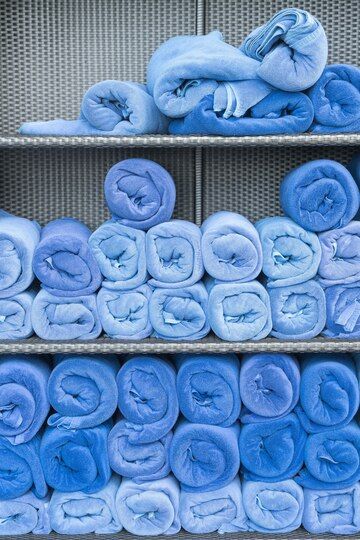 All blue towels rolled neatly