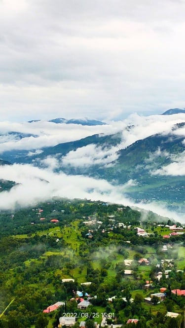 Panoramic view of Moolia village nathiagali , partially covered with clouds 