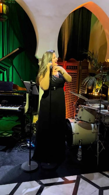 Tatyana Trifonova in a black dress in Rick's Cafe Casablanca