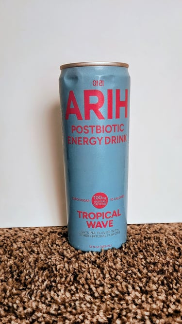 A can of ARIH Postbiotic energy drink, flavor Tropical Wave