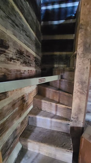Huntsville, AL - Stairs in a cabin are barely 6 inches deep at Burritt on the Mountain