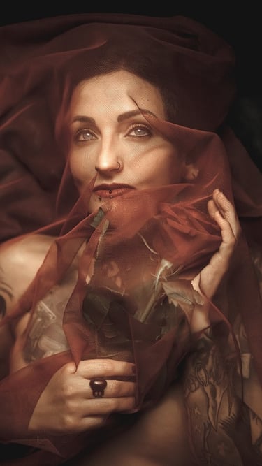 photo of a woman in a red dress with a veil on her head