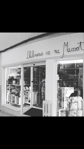 a store front of a store with a woman in a dress