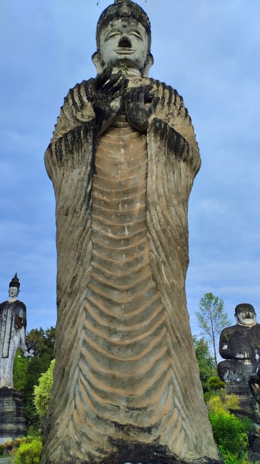 Large standing Buddha stone statue at Sala Keoku sculpture park in Nong Khai, Thailand.
