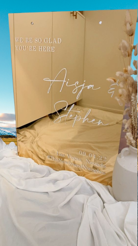 Elegant gold acrylic wedding sign with names Aisja & Stephen.