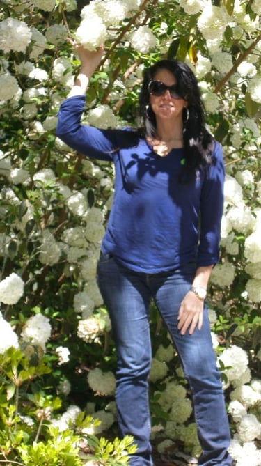 Yvette - model,enclosed,in,virburum,white,blooms, Marnolia+Plantation,