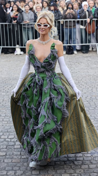 Paris Hilton at Paris Fashion Week 2026 in green gown.