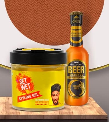 Set Wet styling hair gel and Park Avenue beer shampoo grooming kit for men on a wooden surface.