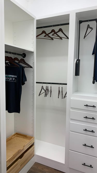 closet with roll out trays and hanging rods 
