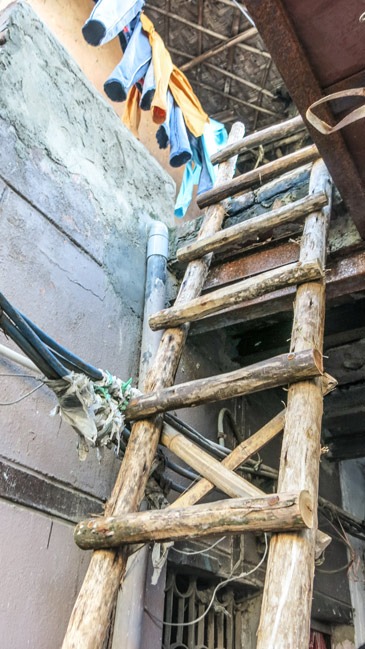 Ladder access to a slum in Delhi