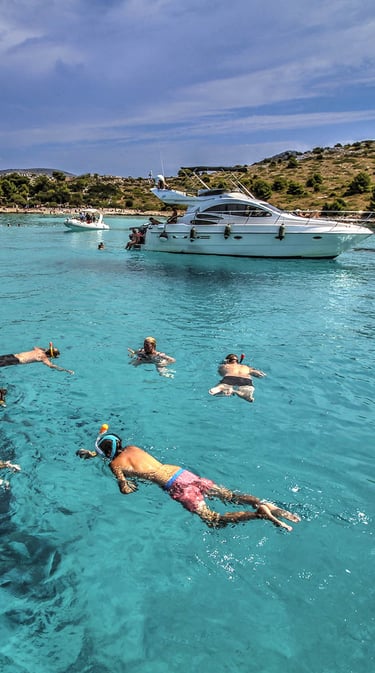 People swimming and snorkling on the Kornati Islands National Park in the Zadar Archipelago.