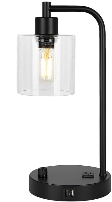 Black bedside lamp with USB port and clear glass shade on white
