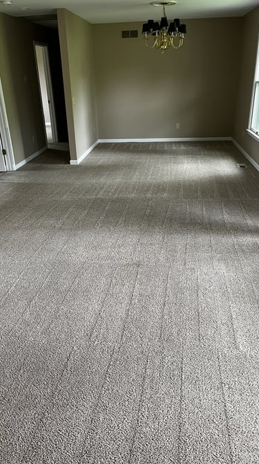 Freshly cleaned residential carpet in living room by Steamaster Carpet Cleaning