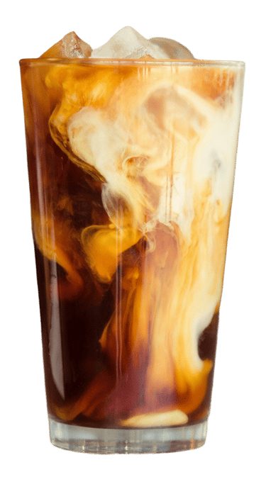 Iced coffee with cream swirls in a tall glass with ice cubes on a white background.