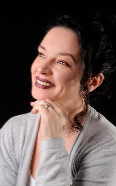 a woman with a smile on her face