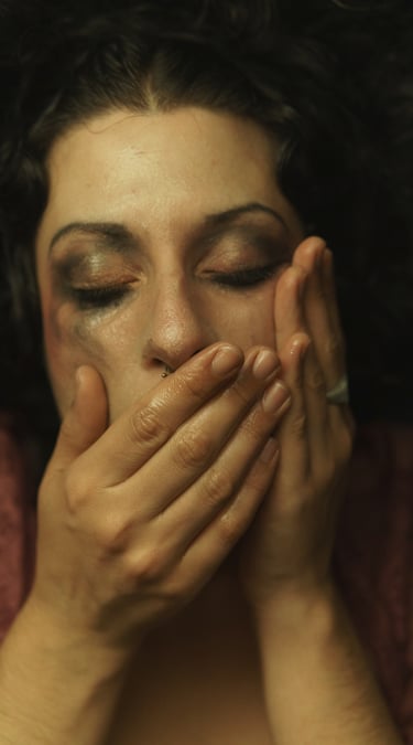 a woman with her hands on her face