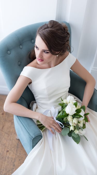 Luxury bridal hair and makeup by Brisbane bridal stylist Liza Formilan, featuring a timeless low bun