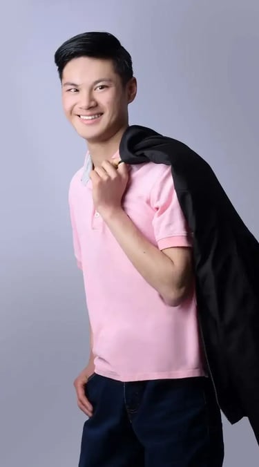 a man in a pink shirt and black jacket