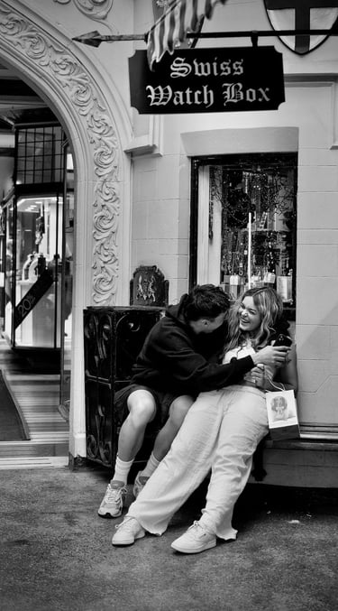 Young lovers on a bench laughing