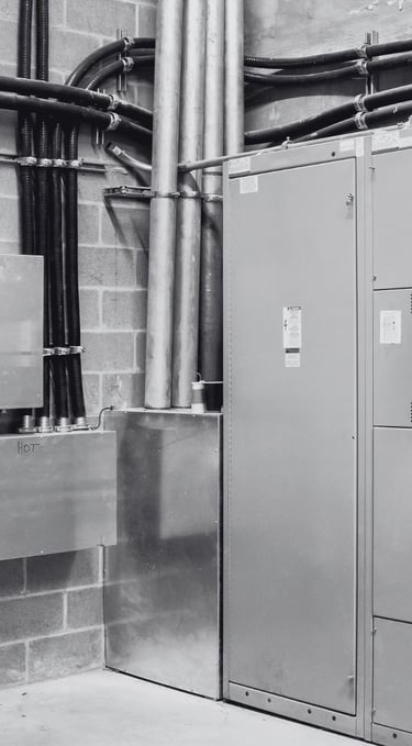 D.A. Electric commercial electrician working on panel Kansas City