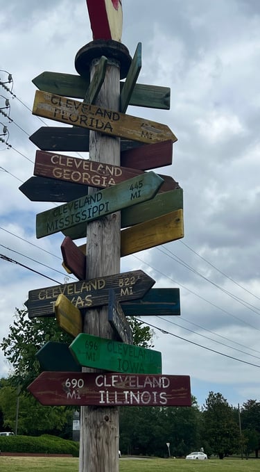 Pole with many different signs on it