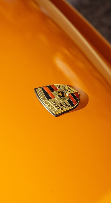 Porsche logo close-up photo captured by BrandNests for automotive marketing and branding.