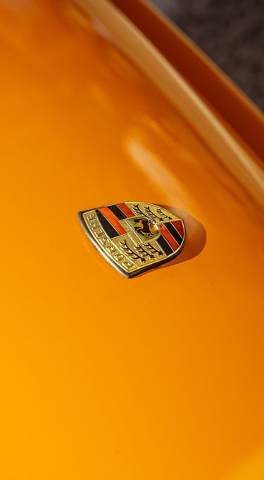 Porsche logo close-up photo captured by BrandNests for automotive marketing and branding.