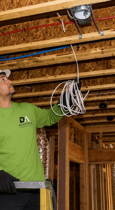 Residential electrician installing wiring in new construction Kansas City
