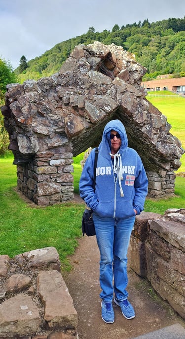 Lady is cold at Urquhart Castle in Scotland