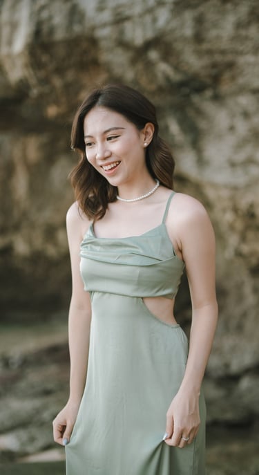 Portrait of woman in green dress during photoshoot at Geger Beach Nusa Dua Bali