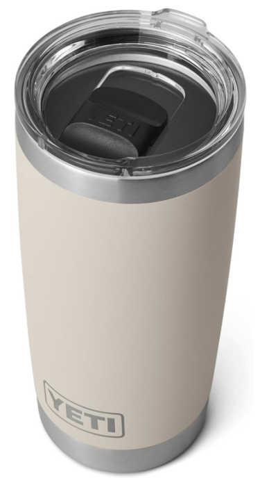 Neutral beige YETI tumbler with clear lid, perfect for cozy drinks.